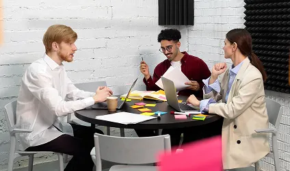 Team working on a marketing plan with sticky notes